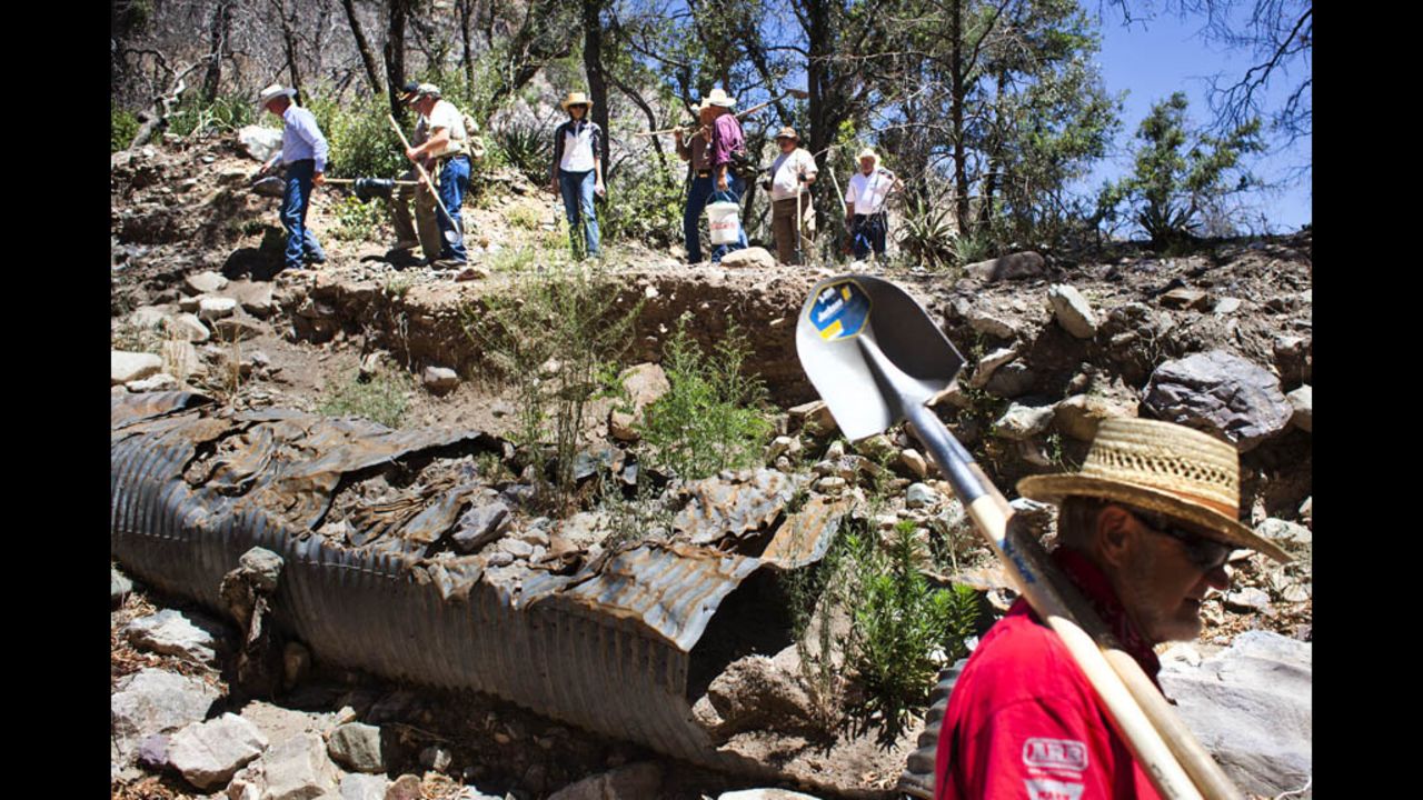 Volunteers make their way through the Coronado National Forest to Gardner Spring, one of the sources of water for the city of Tombstone.