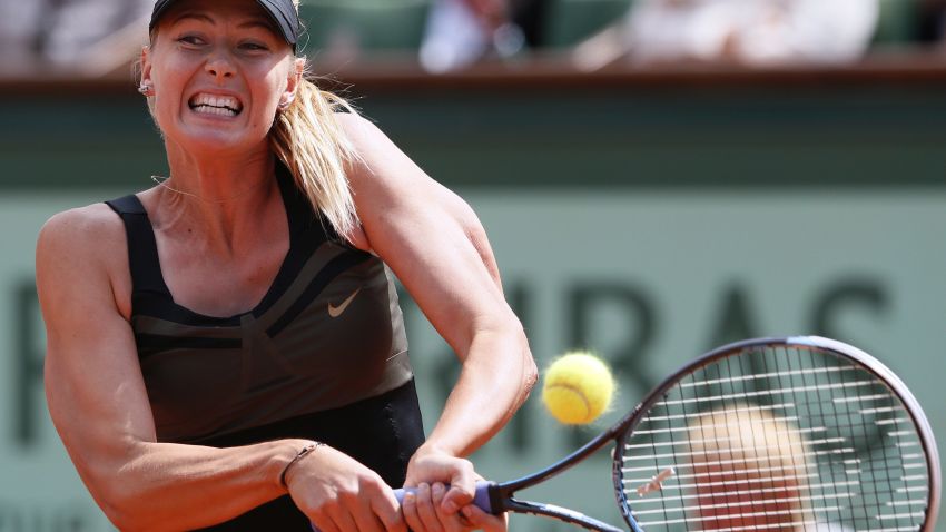 Sharapova becomes the 10th female player to complete a career grand slam.