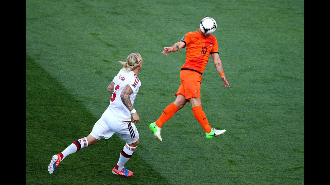 Wesley Sneijder of the Netherlands heads the ball during the match against Denmark.