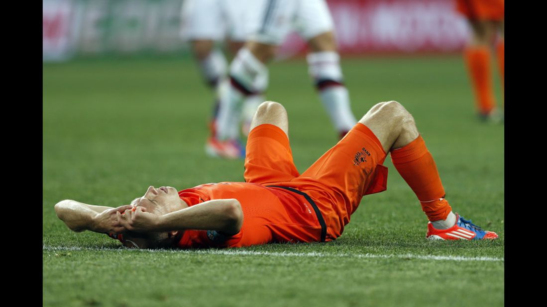 Arjen Robben lies dejected on the pitch after the Netherlands' loss to Denmark on Saturday.