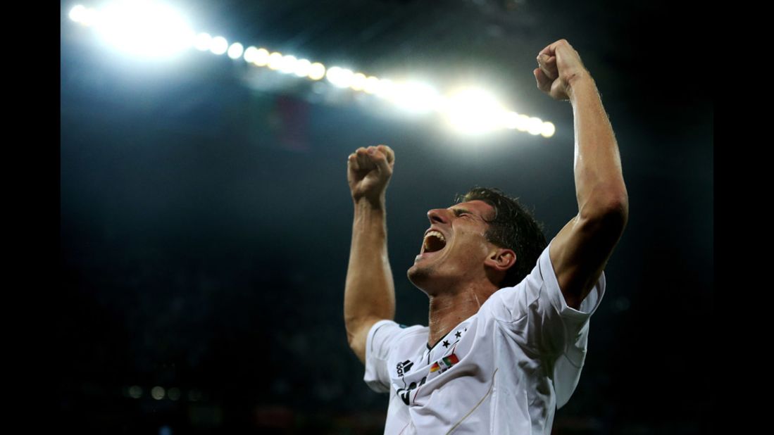 Mario Gomez celebrates Germany's first goal during the match against Portugal.