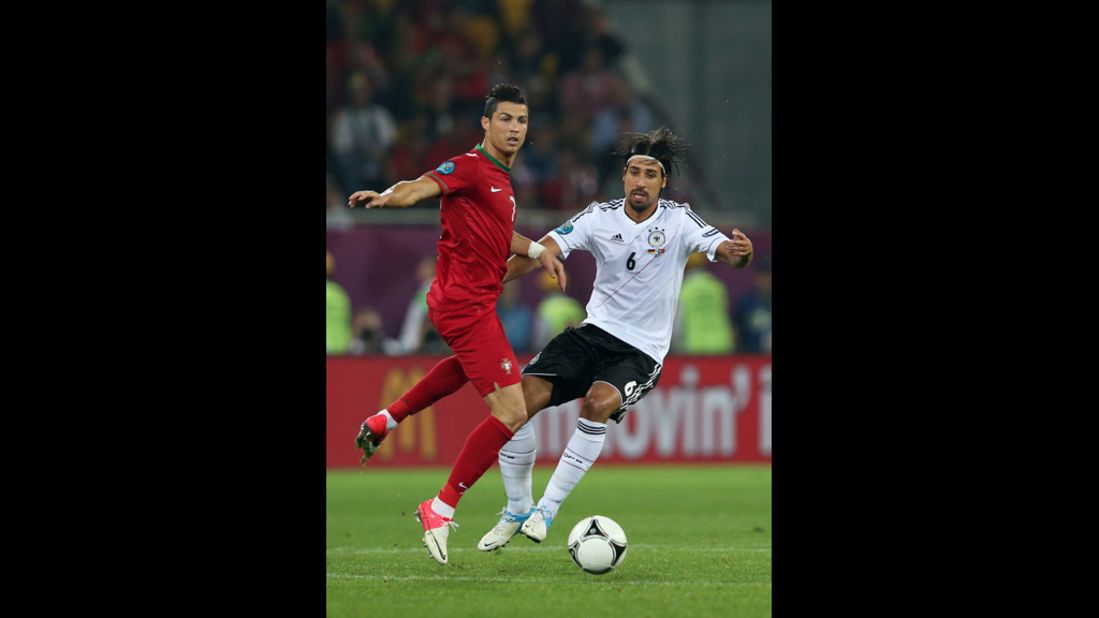 Cristiano Ronaldo of Portugal and Sami Khedira of Germany fight for the ball in a match on Saturday, June 9.