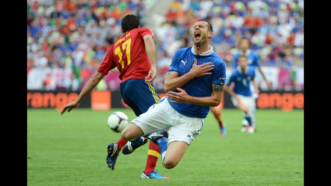 Thiago Motta of Italy takes a fall while playing against Spain on Sunday.