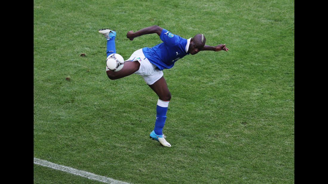 Italy's Mario Balotelli takes control of the ball in Sunday's match against Spain. 