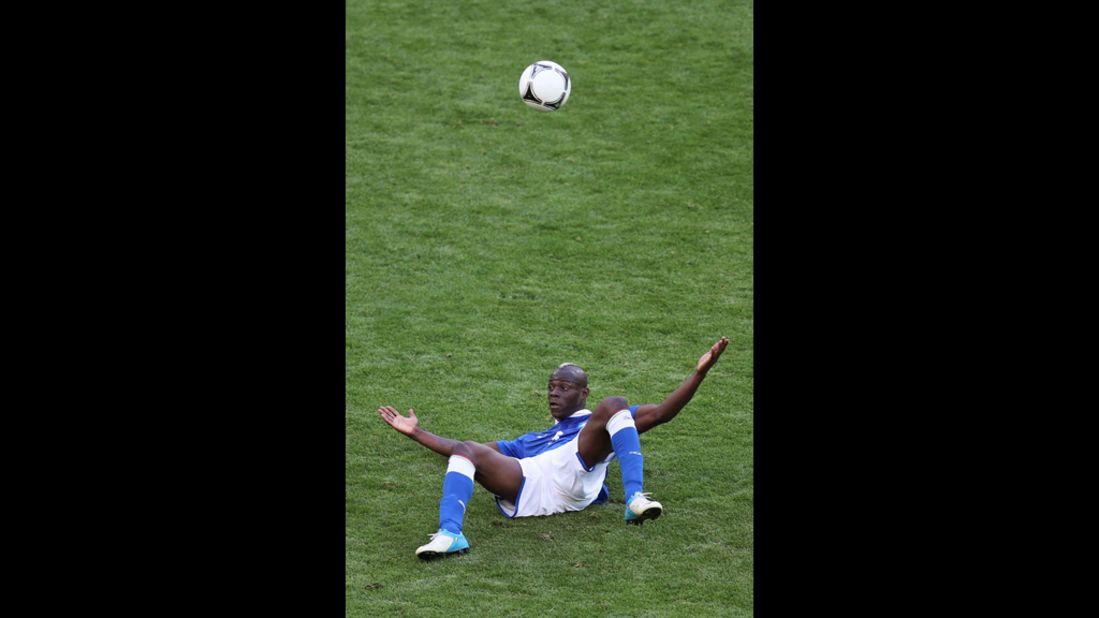 Italy's Mario Balotelli looks up after a fall during the Spain-Italy match.