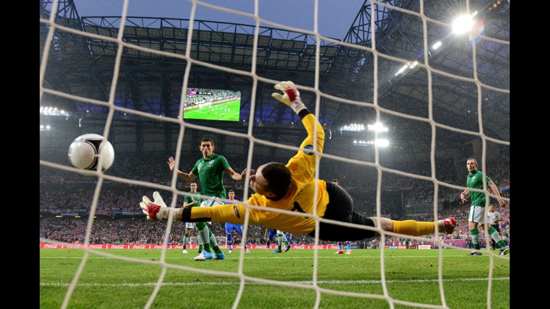 Goalkeeper Shay Given of Ireland fails to stop Croatia's Mario Mandzukic from scoring.