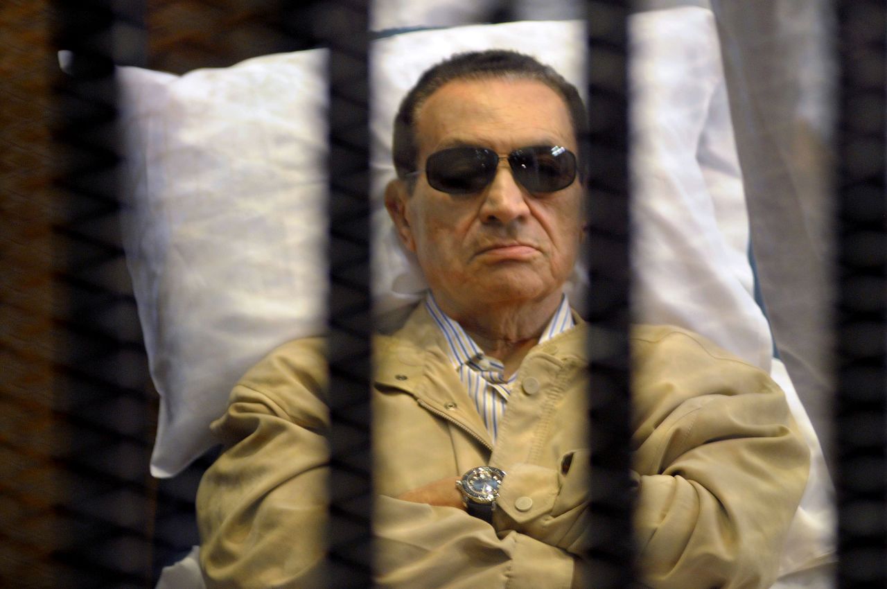 The ousted leader lies in a medical bed inside a cage in a courtroom during his verdict hearing in Cairo on June 2, 2012. A judge sentenced Mubarak to life in prison for his role in ordering the killing of protesters in the 2011 uprisings.
