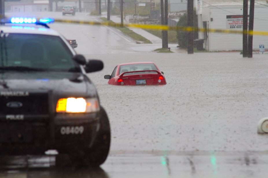 Cars struggled with flooded roads Saturday in Pensacola. "These are areas I have never seen flood like this, and we have endured some pretty big hurricanes through here before," iReporter Randy Hamilton says. 