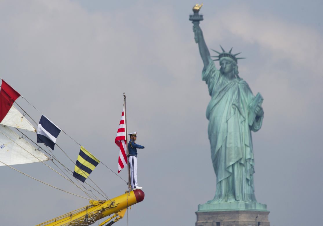 Sailors aboard the Indonesian tall ship "Dewaruci" sail past the Statue of Liberty during Fleet Week in May 2012. 