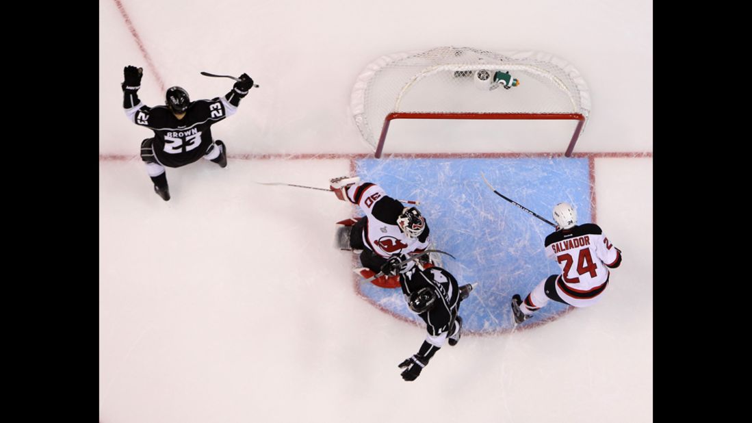 Dustin Brown, left, of the Kings reacts after scoring on a deflection against the Devils.