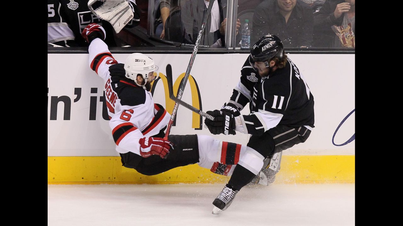 Anze Kopitar of the Kings collides with the Devils' Andy Greene.