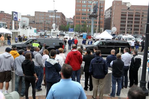 Spectators and press crowd in front of the John Joseph Moakley courthouse in Boston as Bulger and Greig arrive for arraignment on June 24, 2011.