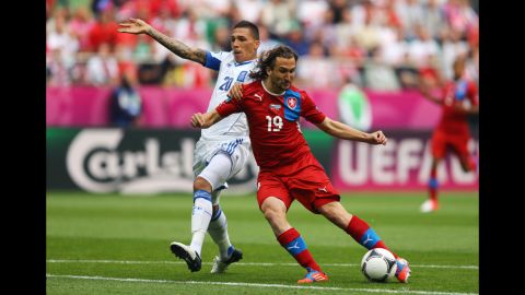 Jiracek scores the Czech Republic's opening goal against Greece and Jose Holebas on Tuesday.