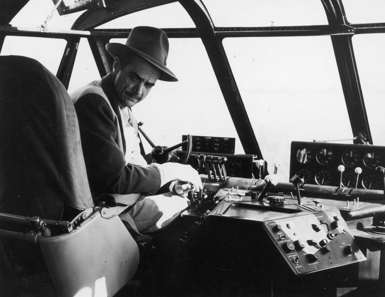 Hughes, pictured here in the plane's pilot seat, flew the H-4 during its only flight. On November 2, 1947, off California's Long Beach harbor, the seaplane became airborne for about a mile and reached an altitude of about 70 feet. Saying it needed more development, Hughes stored it in a hangar and never let it fly again. 