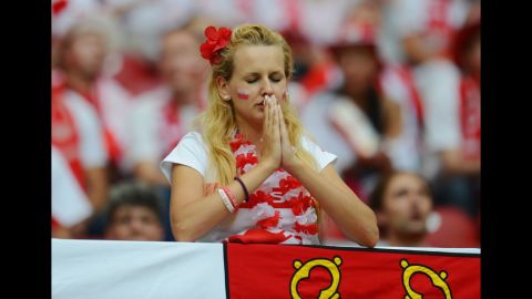 A Poland fan looks thoughtful ahead of the team's match against Russia, Tuesday.
