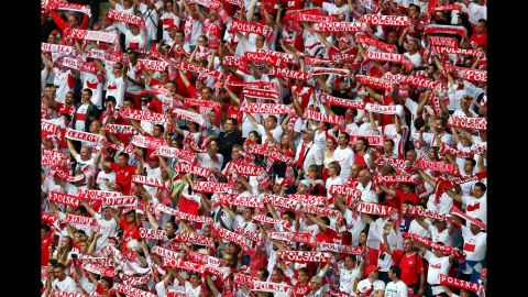 Polish fans cheer during the group A match between Poland and Russia, Tuesday.