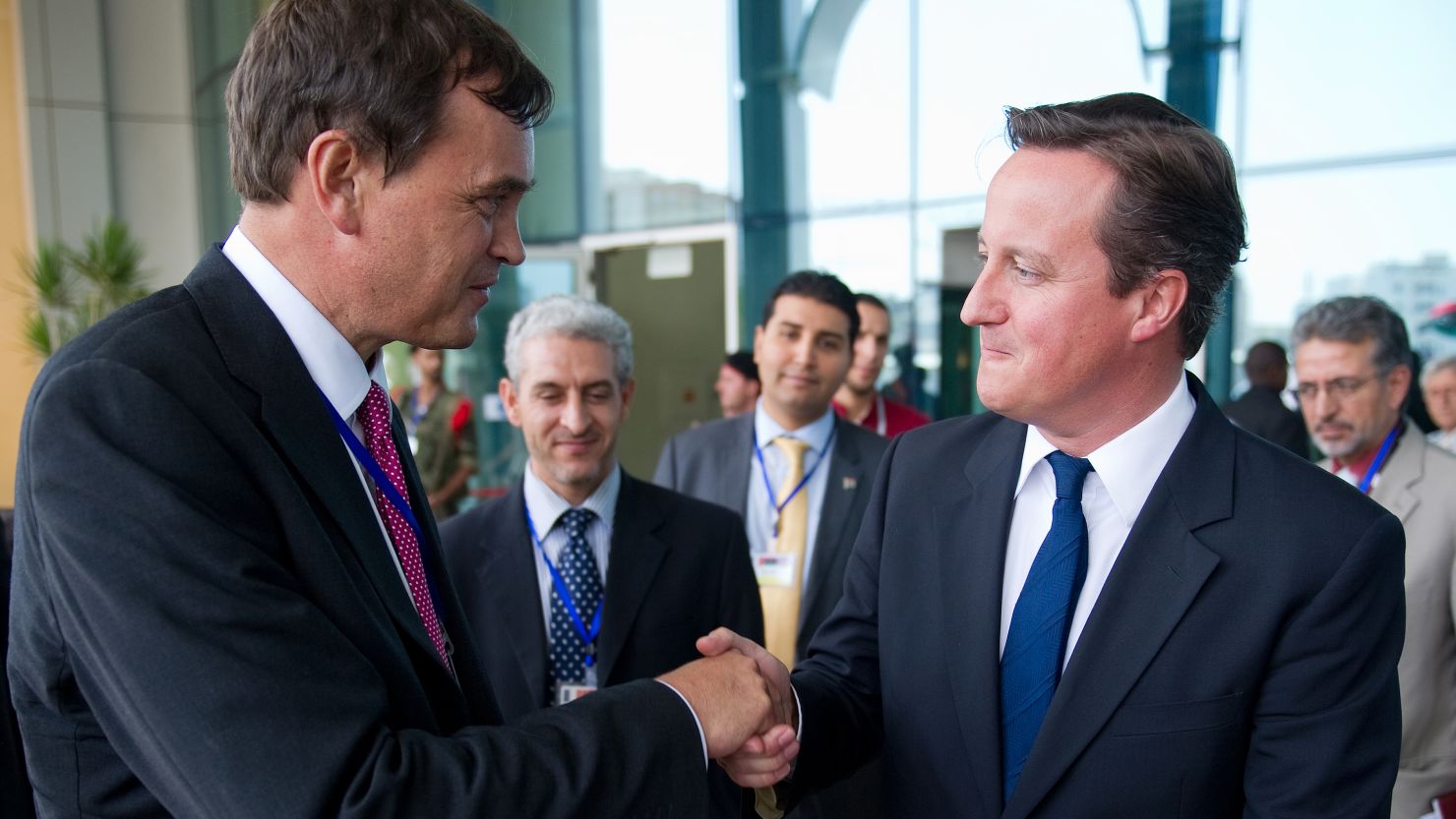 British Ambassador Dominic Asquith, left, with British Prime Minister David Cameron in Tripoli on September 15, 2011. 