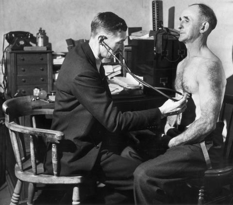 A doctor performs a chest examination in 1948.