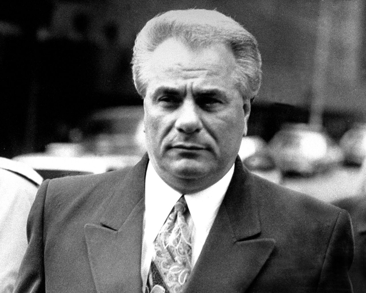 New York Mafia chief John Gotti was known as the "Dapper Don" for his expensive suits and "Teflon Don" due to government charges failing to stick in three trials. He was later convicted of murder and racketeering. He died of cancer at age 61 in 2002 while serving a life sentence.