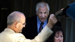 BELLEFONTE, PA - JUNE 13: Former Penn State assistant football coach Jerry Sandusky (C) arrives at the Centre County court house before the third day of his child sex abuse trial on June 13, 2012, in Bellefonte, Pennsylvania. Sandusky is charged with 52 criminal counts of alleged sexual abuse of children. (Photo by Jeff Swensen/Getty Images)