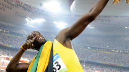 Usain Bolt strikes his trademark pose after claiming gold in the 100 meters at the 2008 Beijing Olympics.