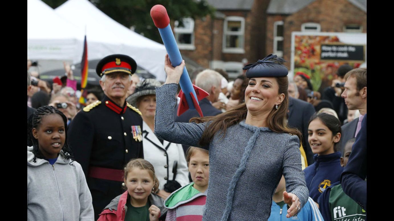 Catherine, the Duchess of Cambridge, throws a foam javelin at a children's sports event during her visit Wednesday to Vernon Park in Nottingham, England.