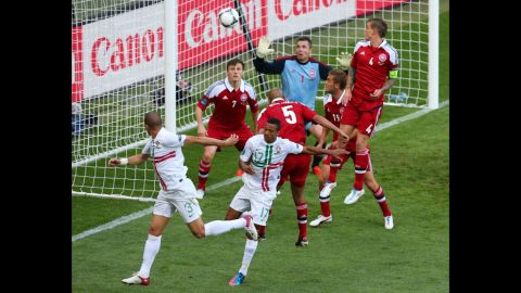 Pepe of Portugal, left, celebrates scores the team's first goal against Denmark.