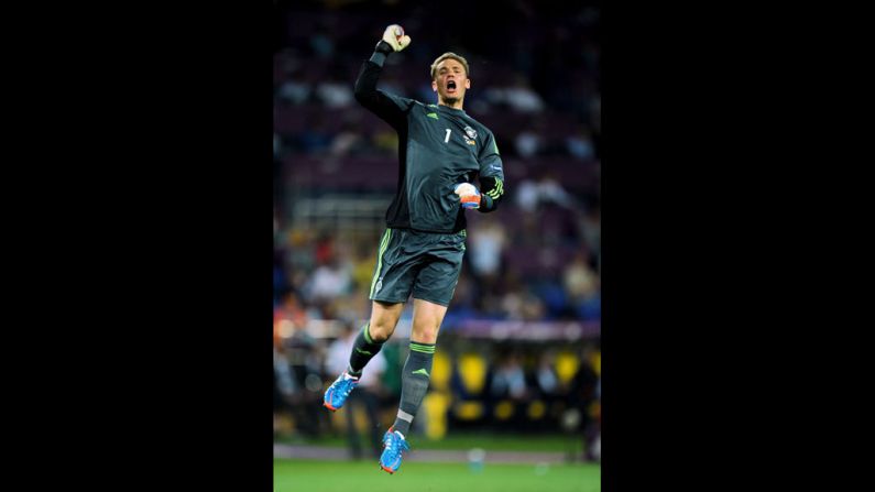 Manuel Neuer of Germany celebrates after Mario Gomez scored the opening goal against the Netherlands.