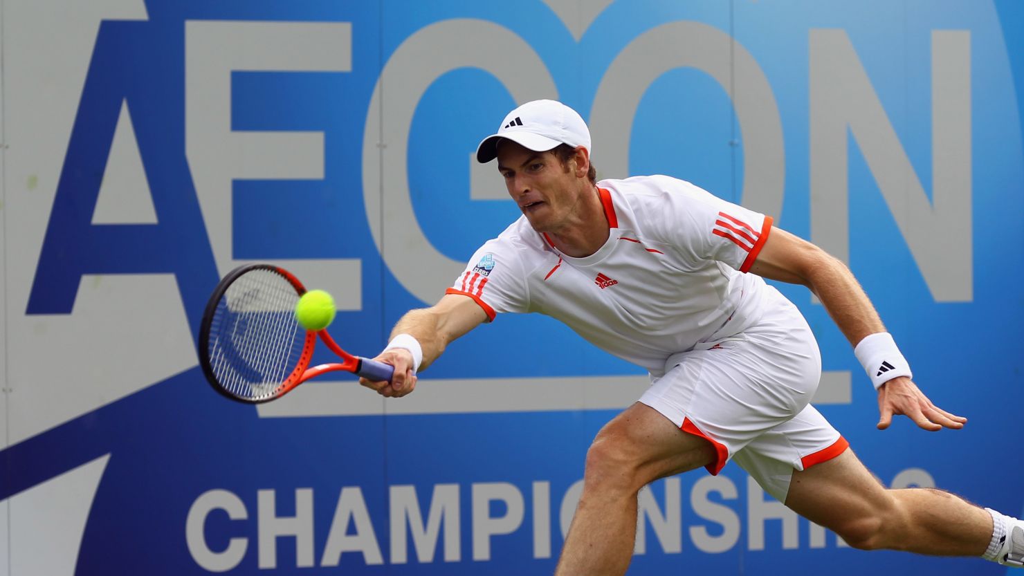Andy Murray stretches for a forehand during his defeat at the hands of Nicolas Mahut 