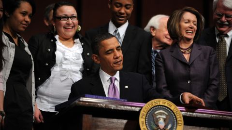 President Barack Obama signs his 2010 health care legislation, which Sandra Fluke thinks would be disastrous to lose.
