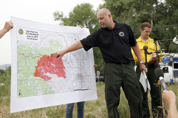 Steve Segin of the U.S. Forest Service shows a map of the size and location of the northern Colorado blaze Tuesday, June 12, in Laporte, Colorado. 