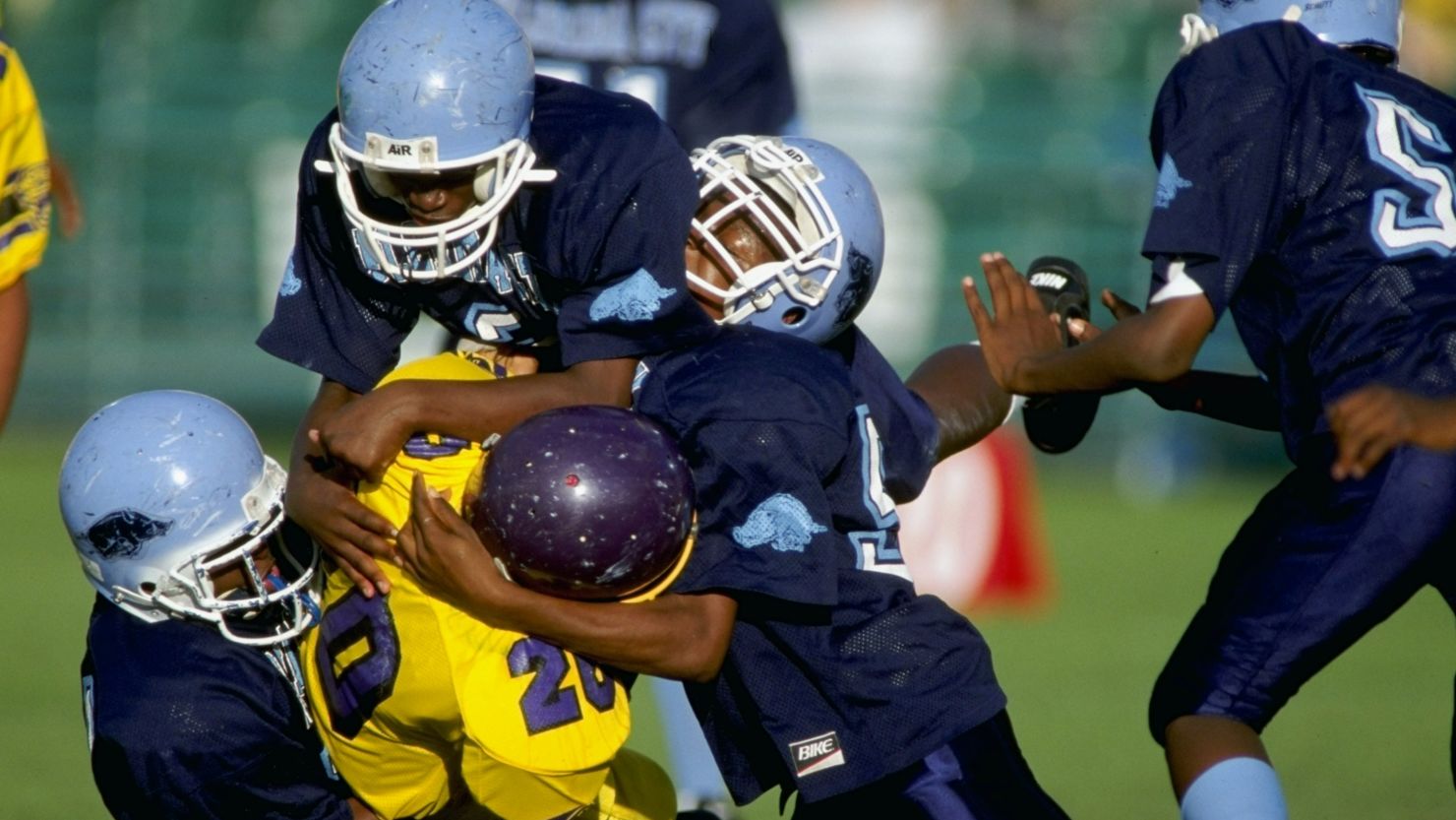 Players compete during the Pop Warner Pee Wee Football Super Bowl in Orlando, Florida. 