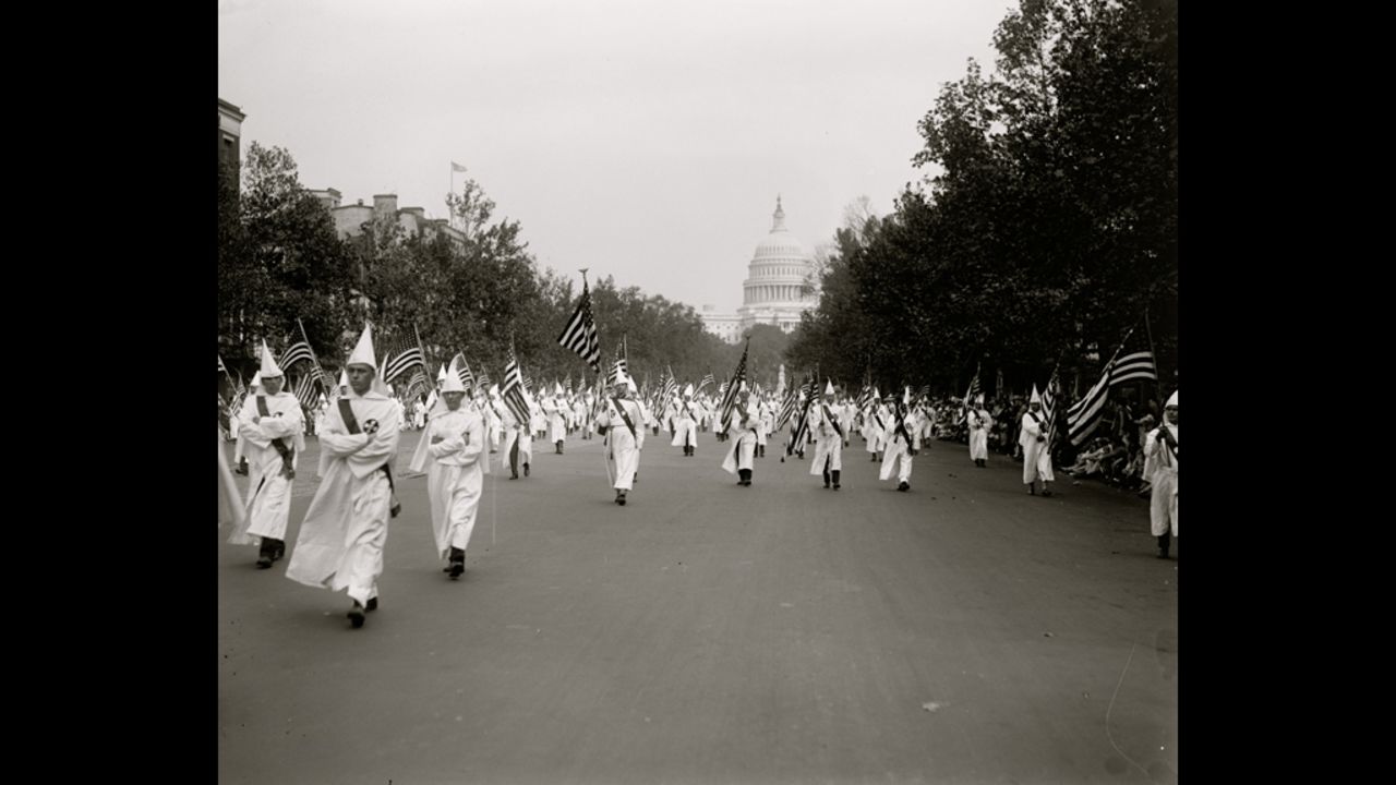 Klan members march in a parade in Washington in 1927.