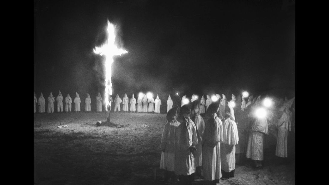 A cross burns in a field during a Ku Klux Klan rally in 1946.