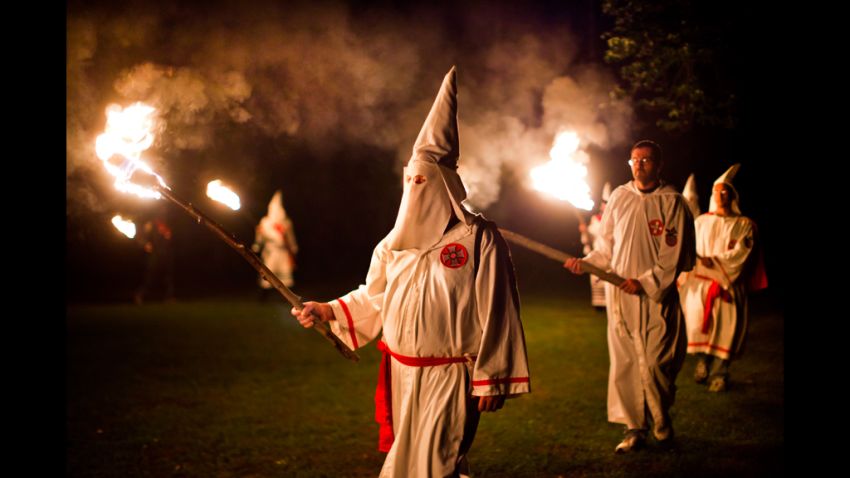 Image #: 15491026    epa02942302 (20/25) Members of the Knights of the Southern Cross of the Ku Klux Klan (KSCKKK), joined by members of other Virginia Klan orders, hold a cross lighting ceremony on private property near Powhatan, Virginia, USA, 28 May 2011. The Invisible Empire is experiencing a revival in the Commonwealth of Virginia. Three chapters of the Ku Klux Klan have reemerged in the state, holding rallies, lighting crosses, and seeking new members. Anger over gay rights, racial changes in the population, and a black president are frequent refrains at these rallies. Yet Klan members say they are not about hate, but about taking pride in their own race. 'The blacks have the NAACP [The National Association for the Advancement of Colored People], the Mexicans La Raza, and the Jews have the ADL [the Anti-Defamation League],' says Stan Martin of the Rebel Brigade Knights of the Ku Klux Klan. 'We whites have the Ku Klux Klan.'  EPA/JIM LO SCALZO /LANDOV