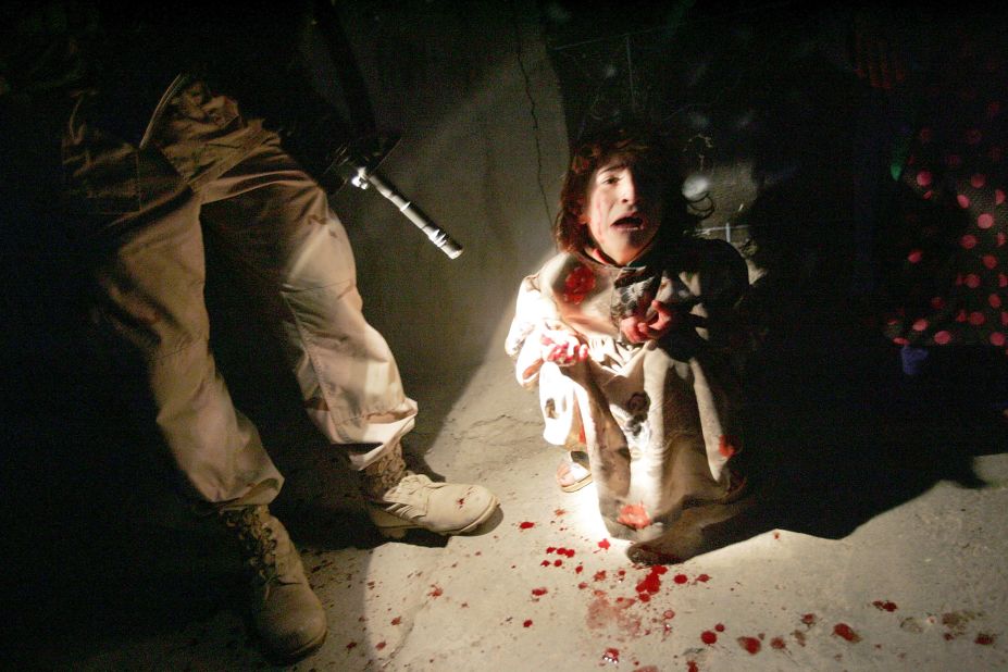 Samar Hassan screams after her parents were killed by U.S. Soldiers in a shooting on January 18, 2005 in Tal Afar, Iraq. The invasion of Iraq by U.S.-led forces ushered in a bloody new era for the country.