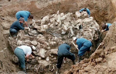 Forensic experts excavate bodies, many of them blindfolded with hands tied, outside the Bosnian village of Pilica. They were thought to be the bodies of Muslim men fleeing Serb forces during the Balkan conflict.