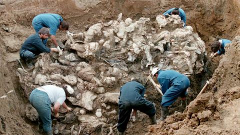 U.N. investigators work at a mass grave in Bosnia that is suspected to contain remains of Muslim men fleeing Srebrenica
