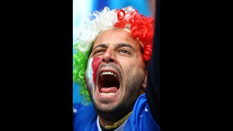 An Italy fan cheers during the team's Group C match against Croatia.