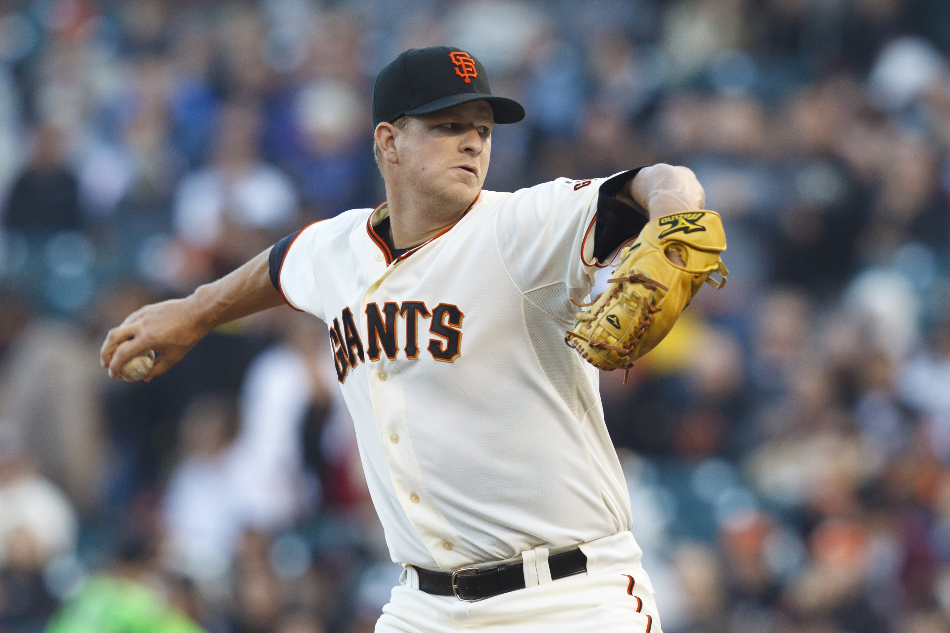 FILE - In this June 13, 2012, file photo, San Francisco Giants pitcher Matt  Cain delivers against the Houston Astros in the seventh inning of a  baseball game in San Francisco. Cain threw a perfect game and the Giants  won 10-0. Seattle Mariners pitcher 