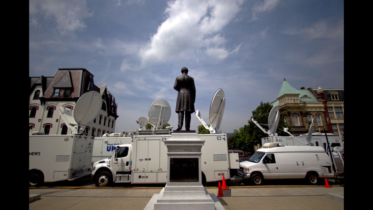 Several news vans pile up outside of the Sandusky trial. The network satellite vans are all parked in front of the Centre County Courthouse and the vans parked in back are live trucks from the regional news outlets. 