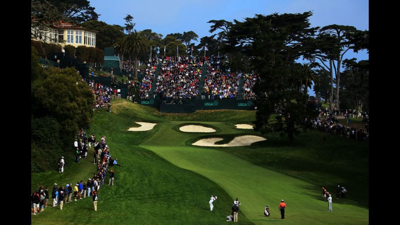 Kevin Na hits a shot to the 18th green.