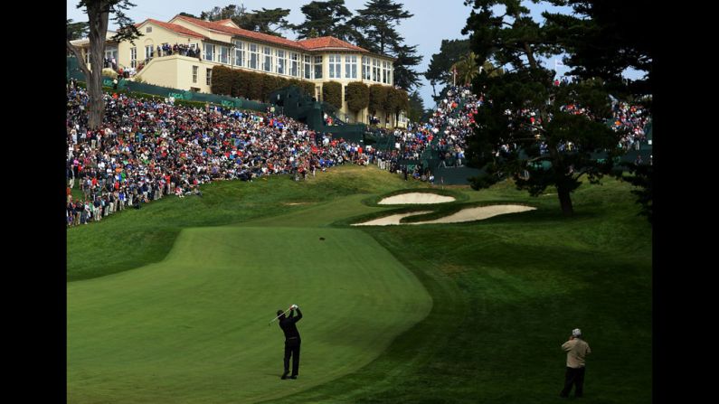 Mickelson takes a shot on the 18th hole.