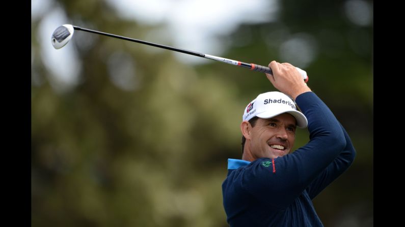 Ireland's Padraig Harrington watches a shot during the first round.