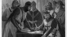 England's King John signs the Magna Carta in 1215.