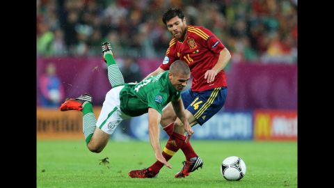 Jonathan Walters of Republic of Ireland clashes with Xabi Alonso of Spain during the match between Spain and Ireland.