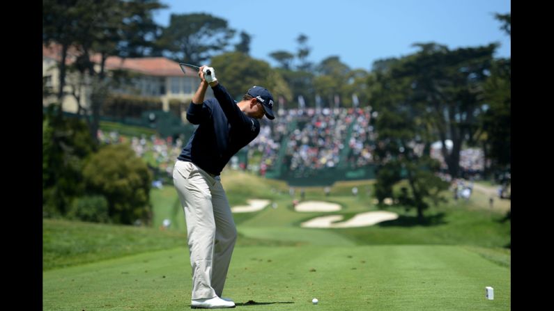 Michael Thompson hits his tee shot on the 18th hole during the first round.