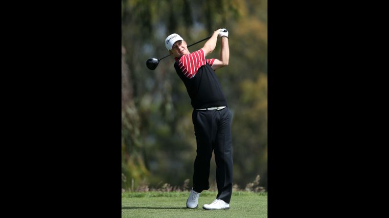 David Toms watches a tee shot on the second hole during the first round.