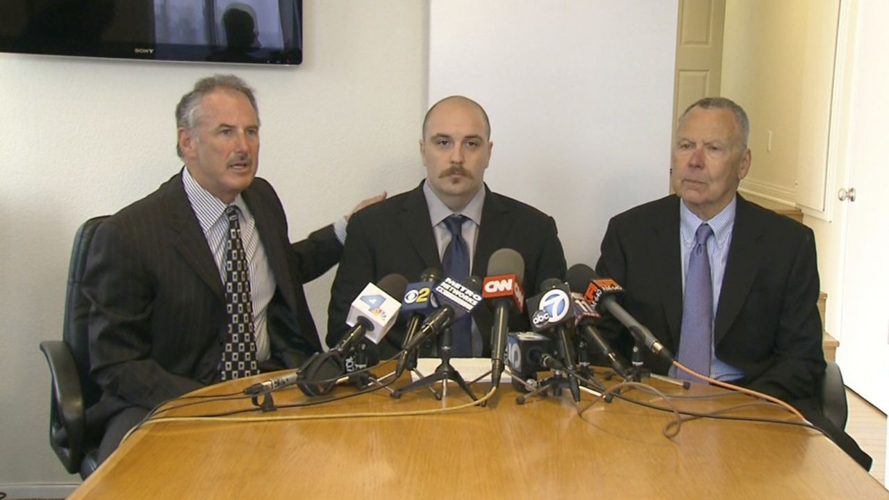 Former security guard Michael Reeves and his attorneys, Stephen Solomon and Stephen Jamieson.