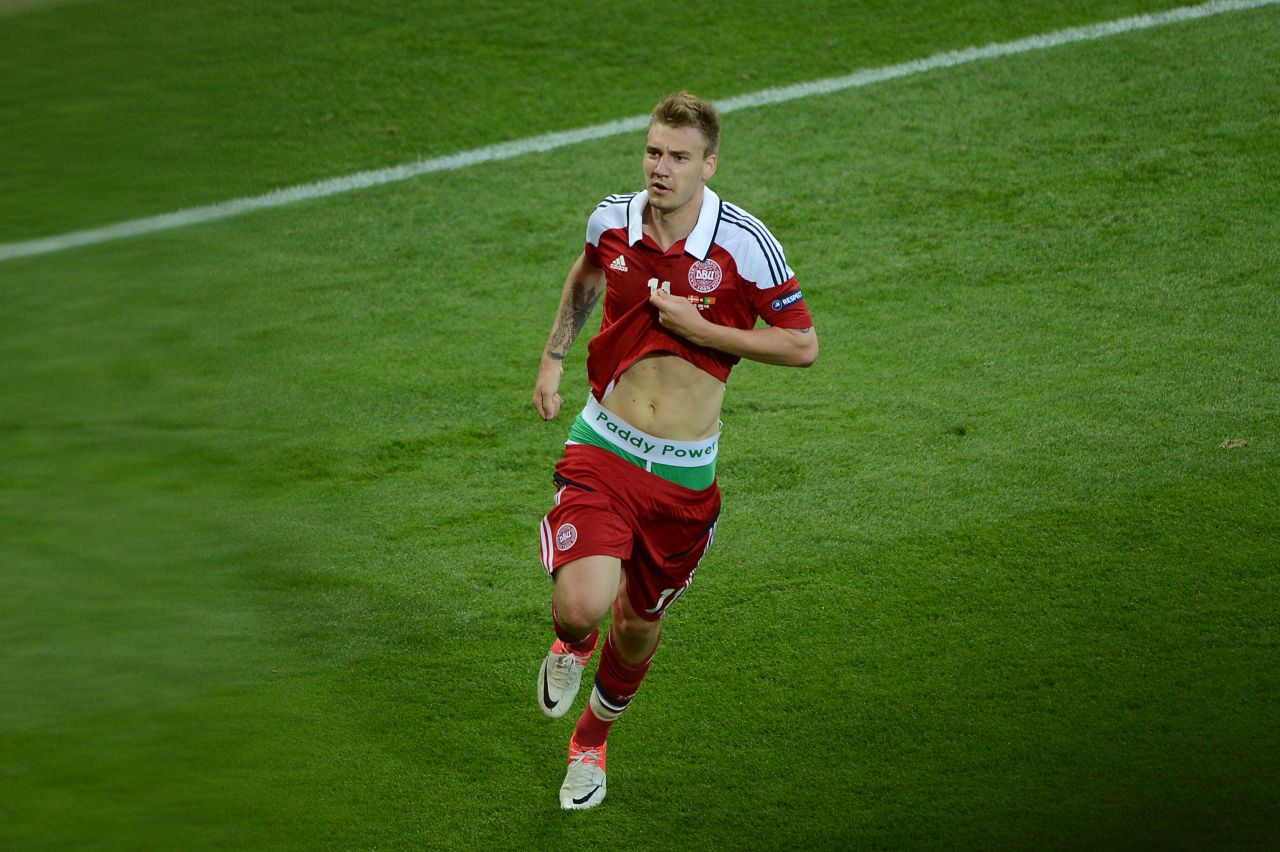 Denmark's Nicklas Bendtner was given a one-match ban and a $126,000 fine after he lifted his shirt to reveal a betting company's logo on his underwear  while celebrating a goal against Portugal in a Euro 2012 group game. 